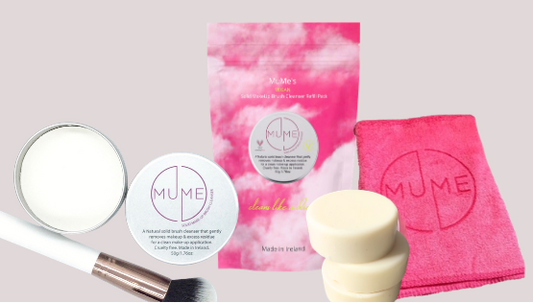 Muse beauty products including a mirror, brush, and towel on a pink background