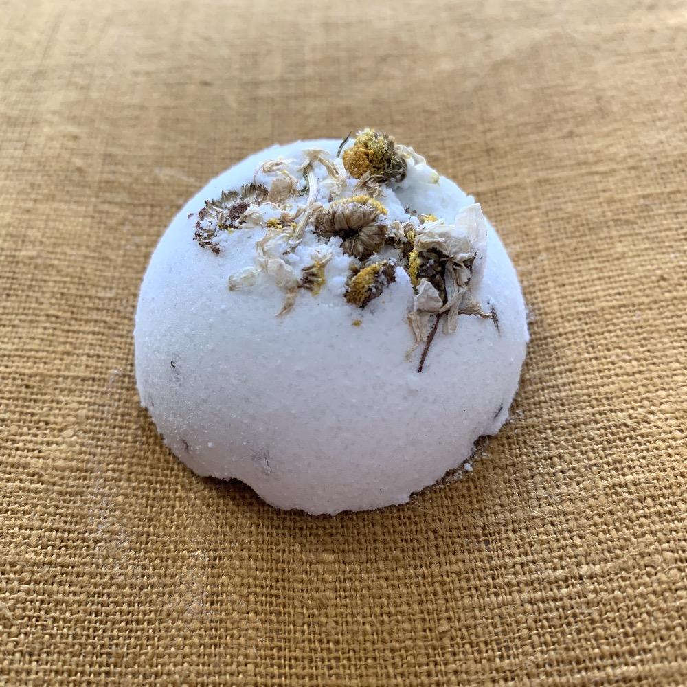 White bath bomb with flower petals