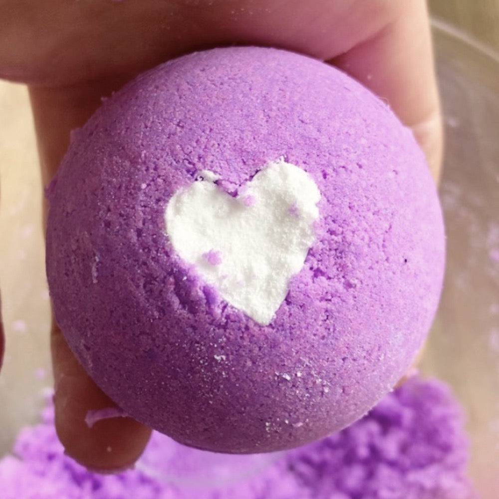 Purple bath bomb with white heart