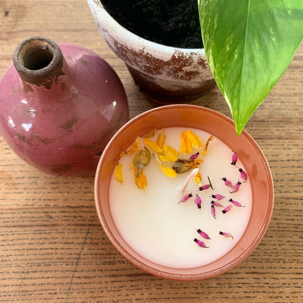 soy wax candle decorated with flower petals